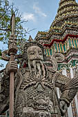 Bangkok Wat Pho, chinese style door guardians of the monumental gates of the outer walls of the temple compund. 